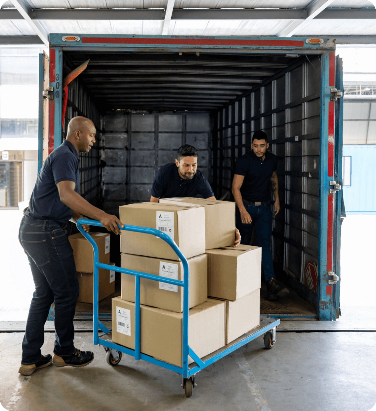 Workers loading boxes into a truck