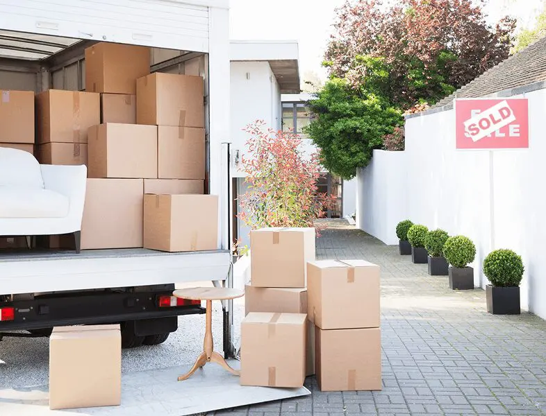House sold with moving boxes outside
