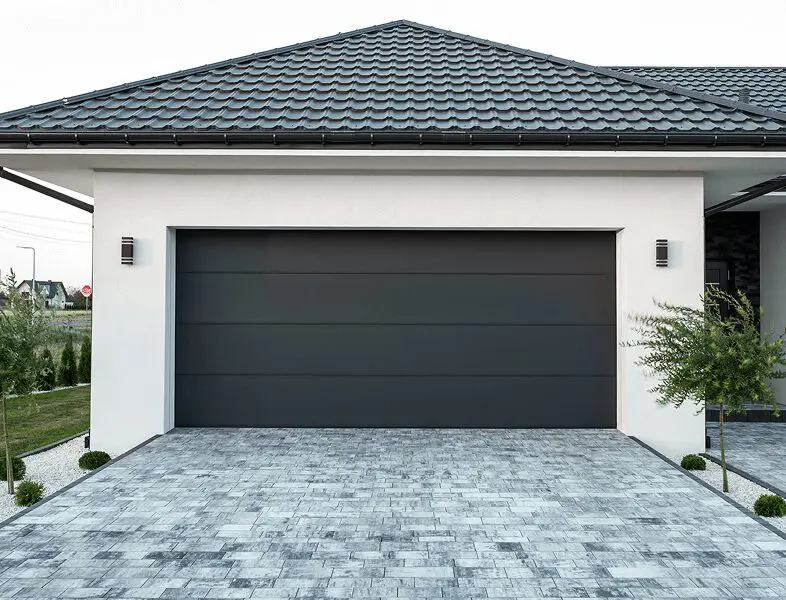 Sleek black garage on white building