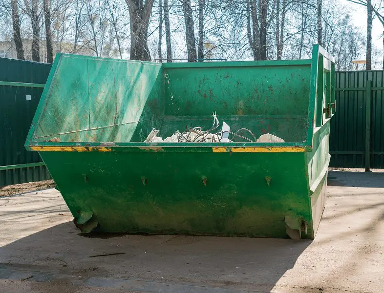 Large green waste container outside